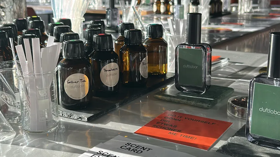 Perfume bottles displayed on a marble counter.