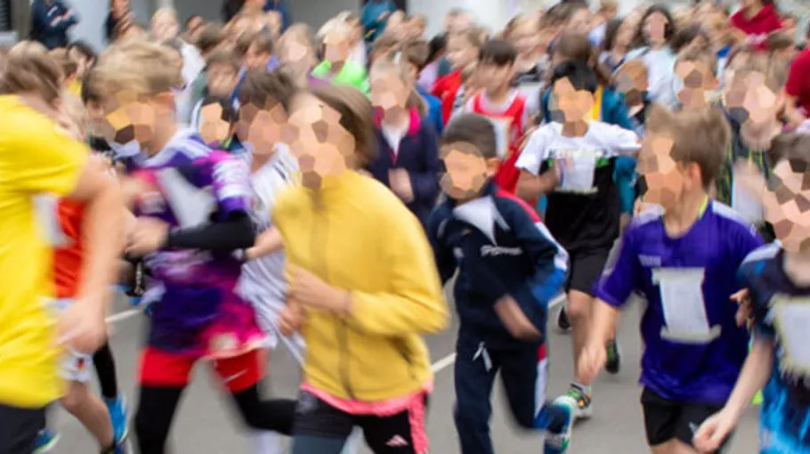 People running in a crowded charity event.