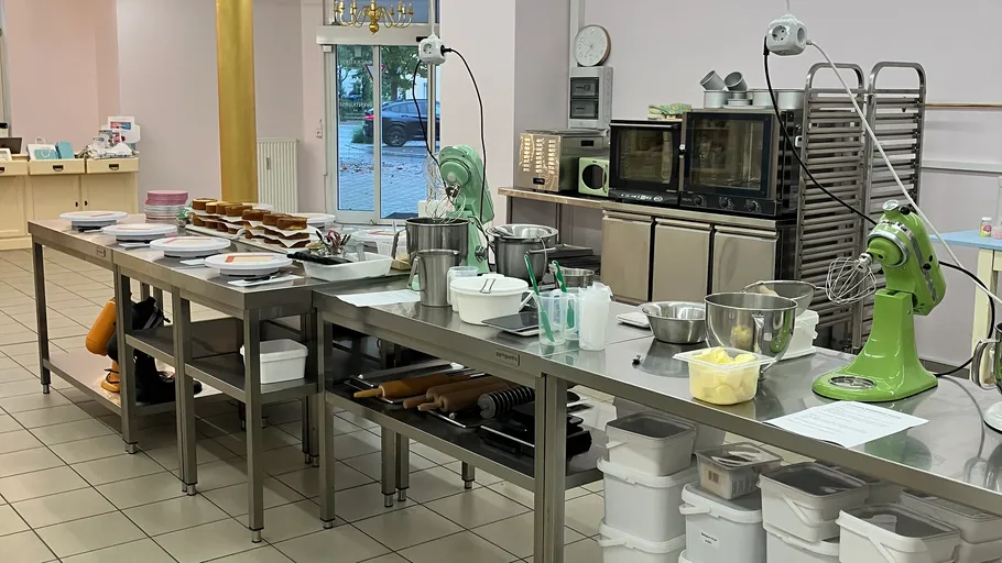 Professional kitchen with baking equipment setup.