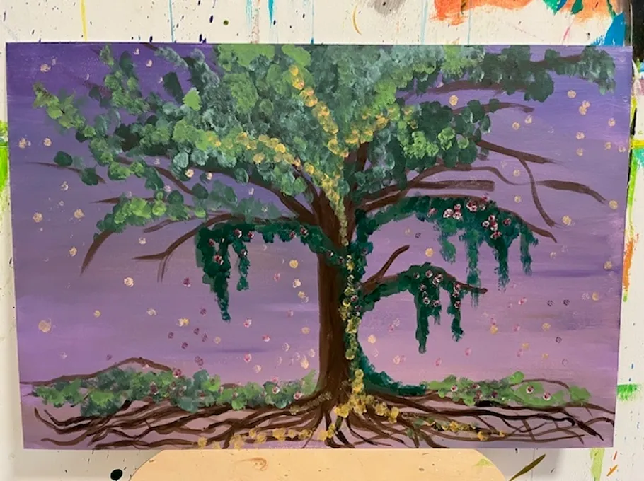 Colorful tree painting on a wooden board.