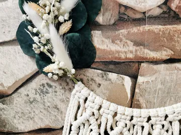 Creative wall decor made from macrame, flowers and natural materials.