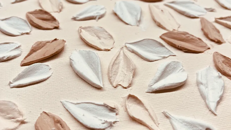 Textured paint strokes on a canvas background.