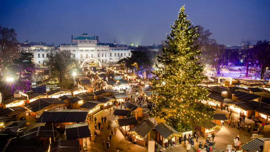 Christmas market with tree and festive lights.