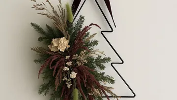 Decorative wreath on geometric wire tree frame.