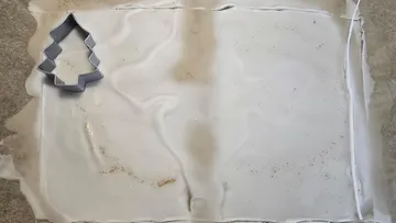Tree cutter on frosted wax paper sheet.