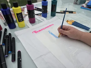 Hand painting Eiffel Tower using stencil.
