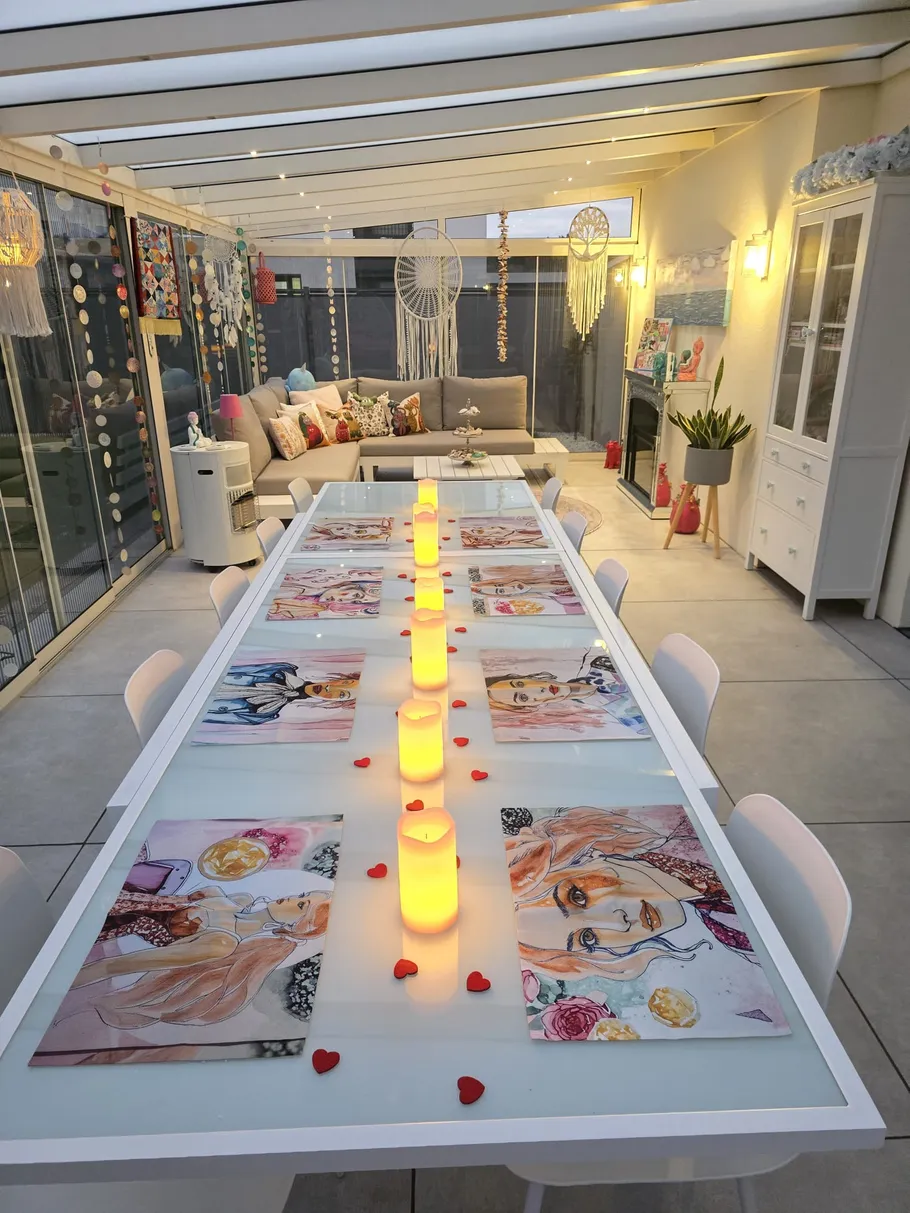 Indoor table setting with candles and decorations.