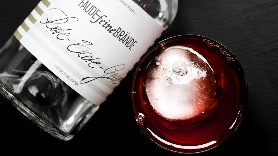 Bottle and cocktail with ice cube.