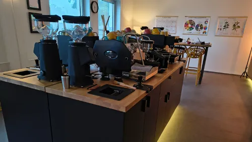 Coffee machines on a wooden counter in café.