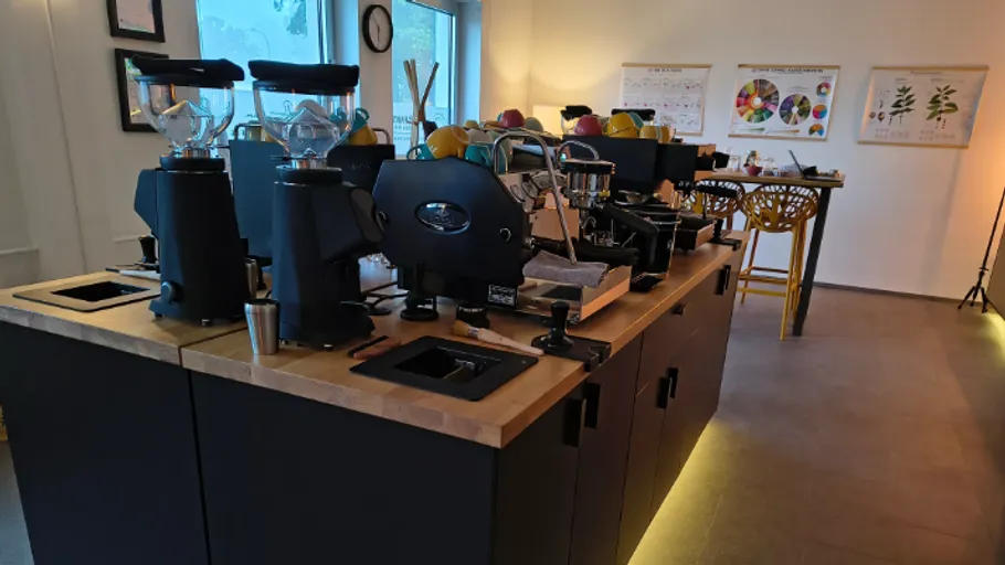 Coffee machines on a wooden counter in café.