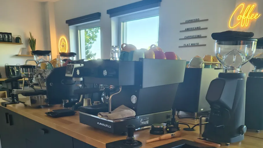 Coffee machines lined up on a counter.