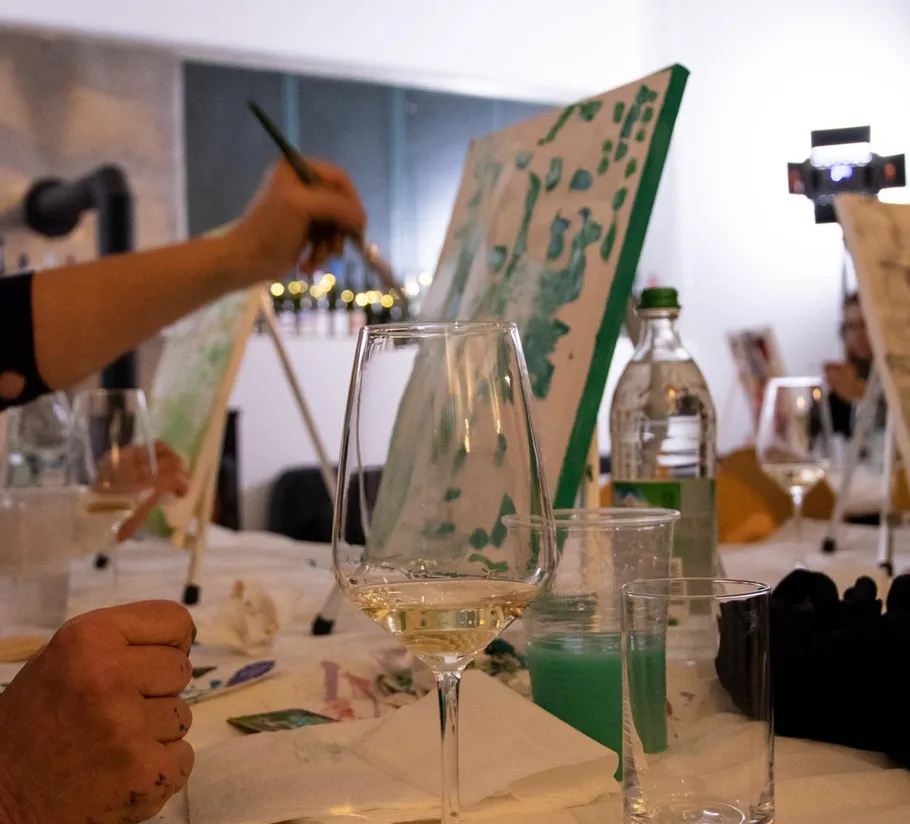 Canvas painting with wine glass on table.