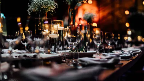 Decorated table with candles and glasses.