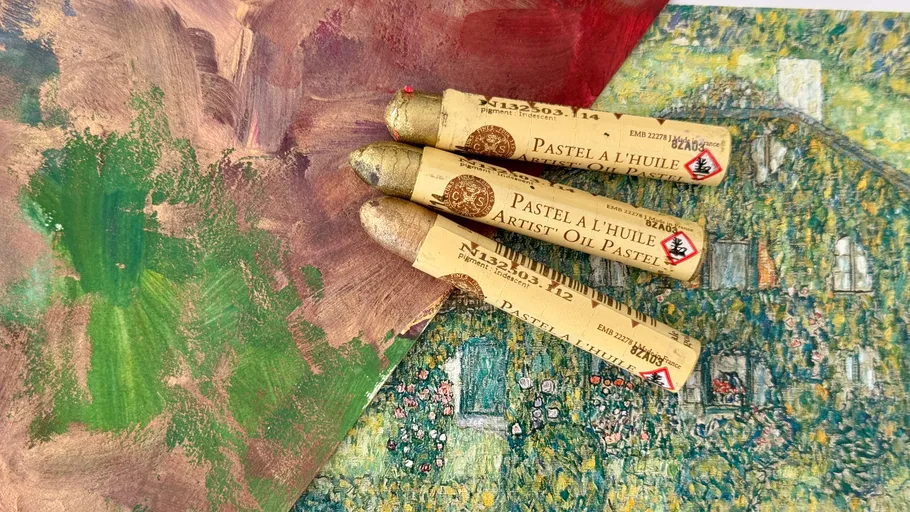 Three oil pastels on artistic background.