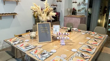 Table set with crafts and fall decorations.