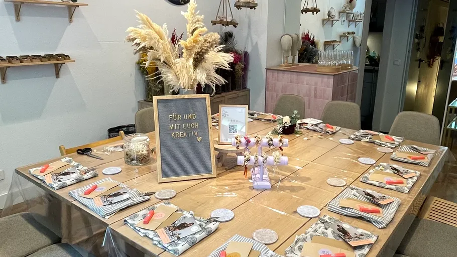 Table set with crafts and fall decorations.