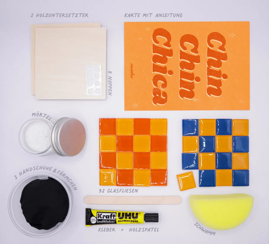 Craft kit with tiles and instructions card.