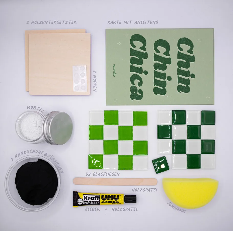 Craft kit with coasters, tiles, glue, instructions.