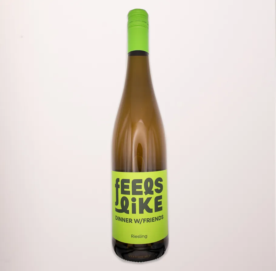 Wine bottle with green label, plain background.