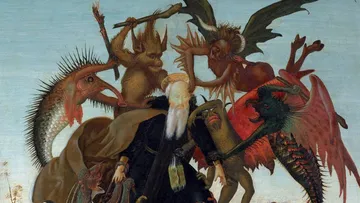 Man surrounded by fantastical creatures, fighting off attacks.