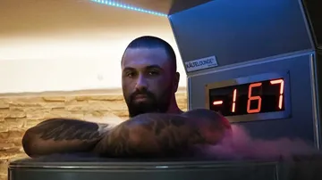 Man in cryotherapy chamber, temperature display -167.
