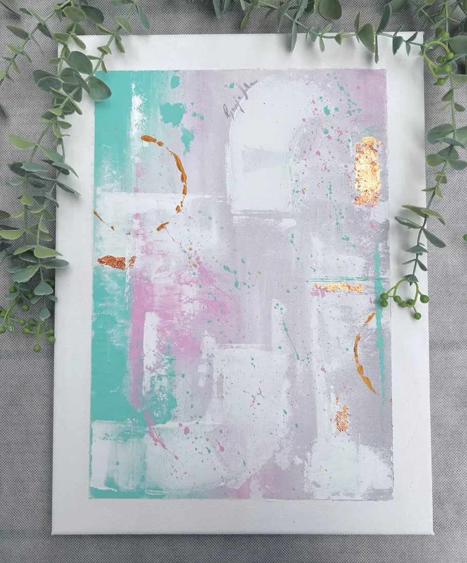 Abstract painting with leaves on grey surface.