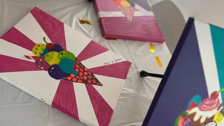 Colorful ice cream paintings on a table.