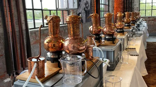 Copper stills aligned for distillation process.