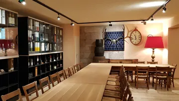 Long tables and chairs in a cozy room.