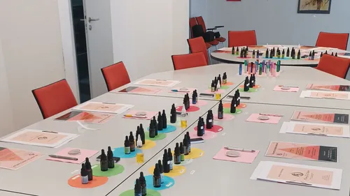 Conference room with tables and essential oils.