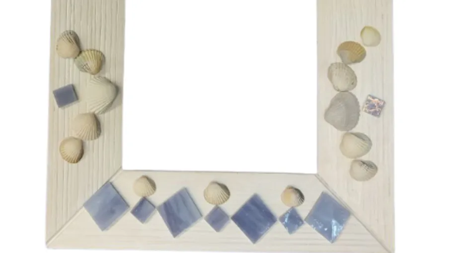 Decorative frame with shells and tiles.