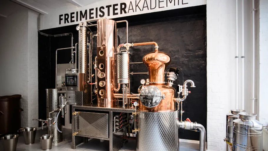 Copper distillation equipment in industrial setting.