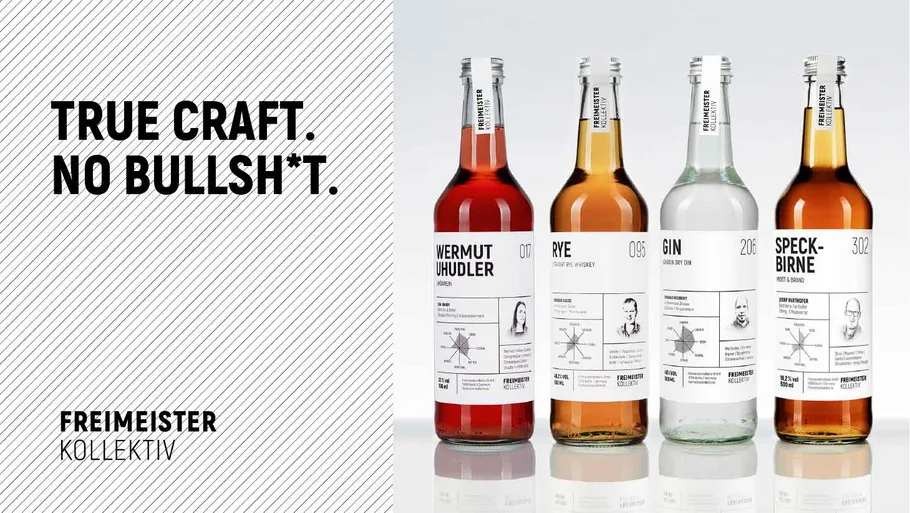 Four bottles displayed on reflective surface.