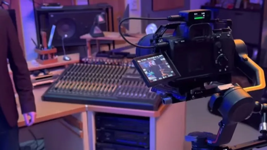 Camera filming in a recording studio.