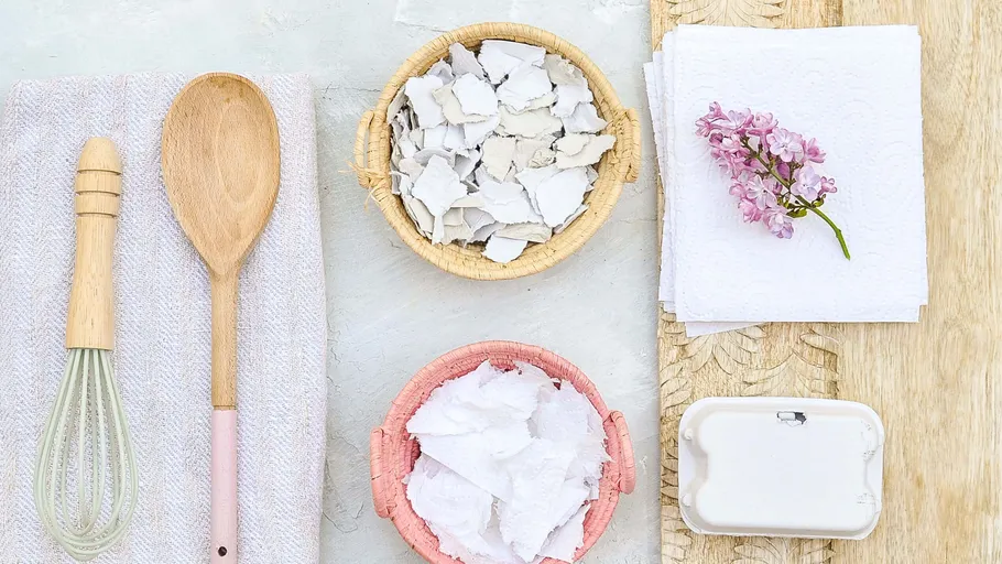 Cooking utensils and bowls on a light background.