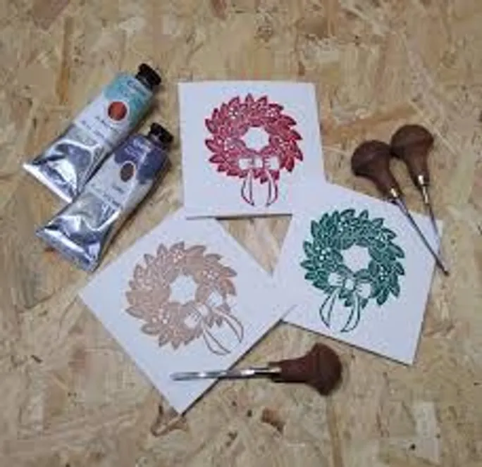 Ink tubes, block prints, carving tools on wood.