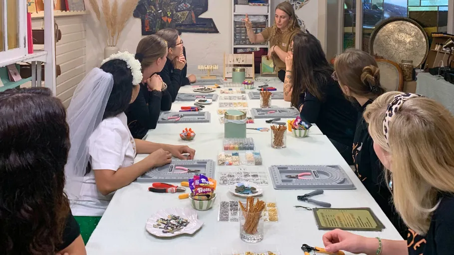 Group making crafts at a long table.