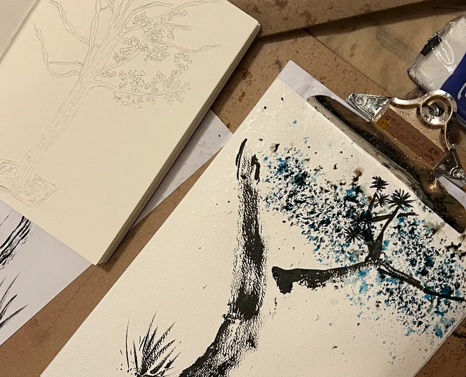 Artistic tree drawing on paper with clipboard.