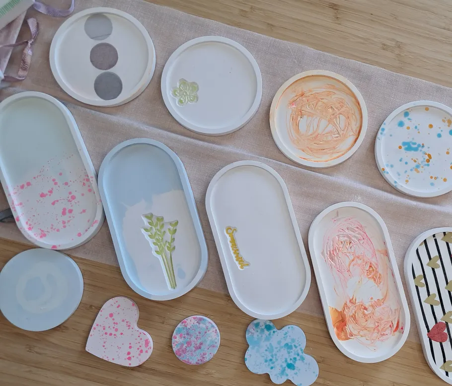 Decorative trays and shapes on wooden surface.