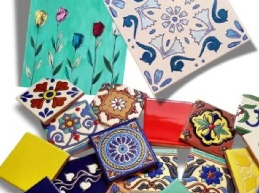 Colorful decorative tiles arranged on a surface.