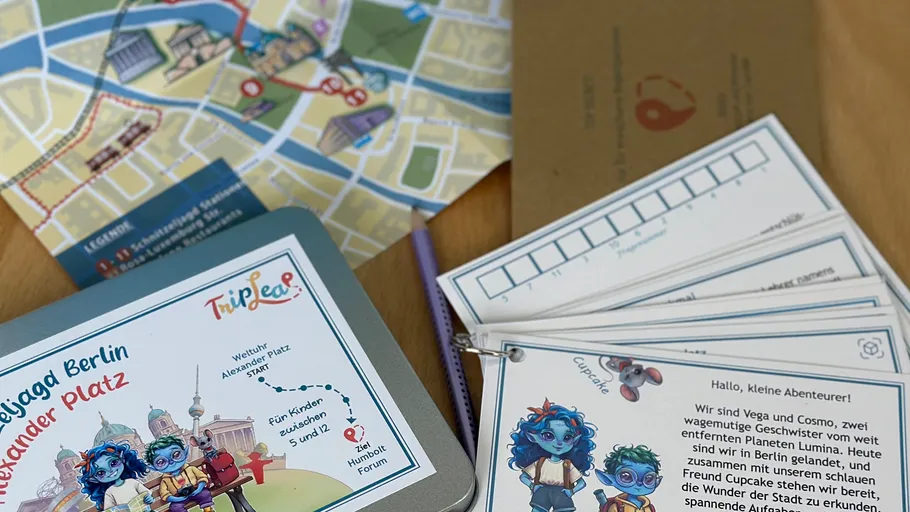 Children's map and adventure cards on a table.