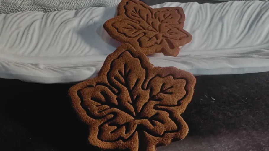 Leaf-shaped cookies on a white plate.
