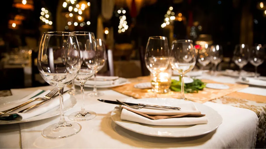 Elegant table setting in a dim restaurant.