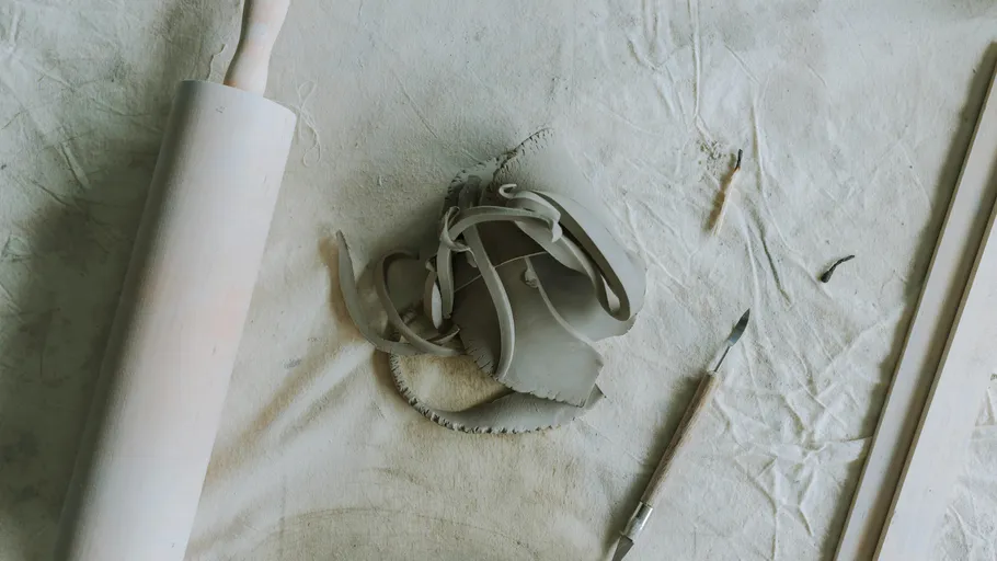 Clay tools on textured fabric surface.