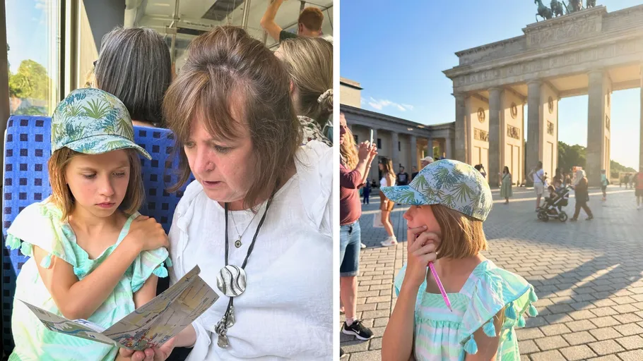Child with woman on train, then outside landmark.