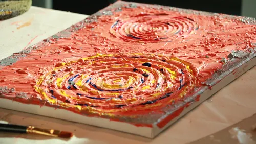 Textured painting on canvas with swirls.