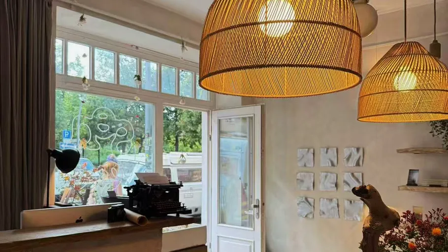Cozy interior with hanging wicker lamps.