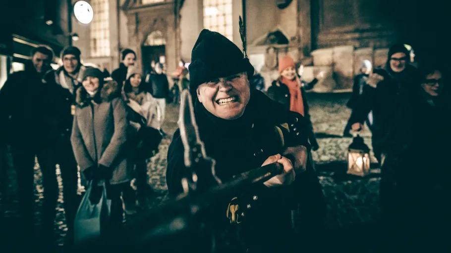 Person dressed in historical costume during evening event.