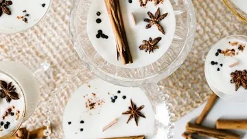 Cinnamon spice drinks on a woven mat.