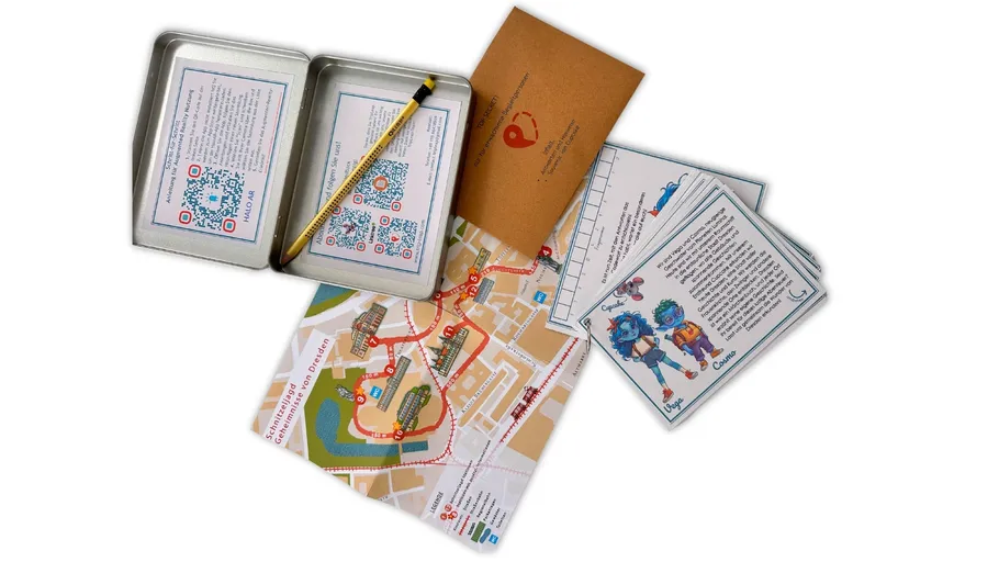 Metal case and map with cards, pencil nearby.